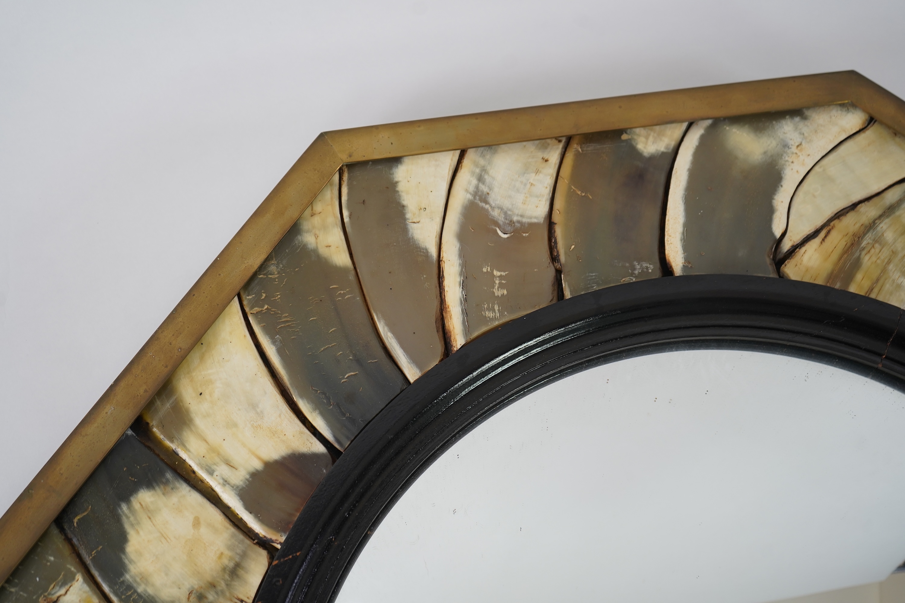 Anthony Redmile (b. 1940) An ebonised wood and horn mounted octagonal convex wall mirror